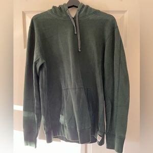 Dark green midweight Reigning Champ hoodie.
